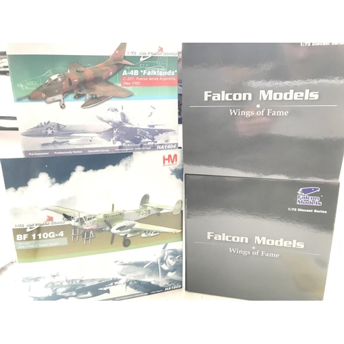 24 - A collection of 4 boxed military aircraft including Hobbymaster and Falcon models.