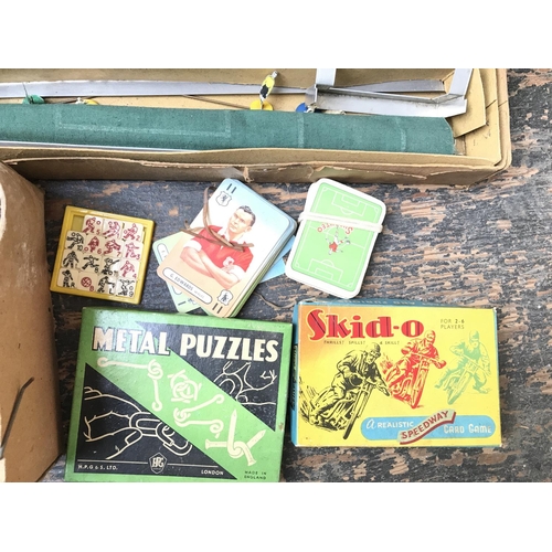 269 - A Collection of Vintage games including Skid-o, Football and a horse racing set.