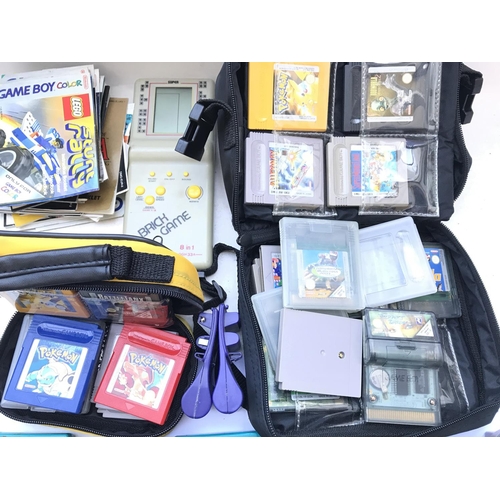 313 - 3 x Game Boy Colors including games and Manuals. Also a Printer. Camera. And 2 other hand held games... 