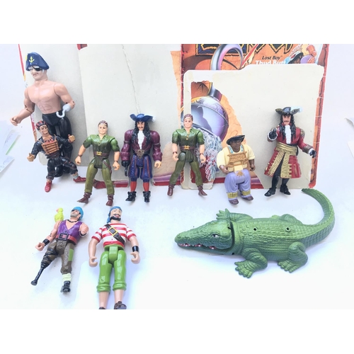 314 - A Box Containing a Collection Of Hook Action Figures. accessories and trade cards.