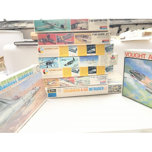 32 - A box containing various Aircraft model kits including Monogram,