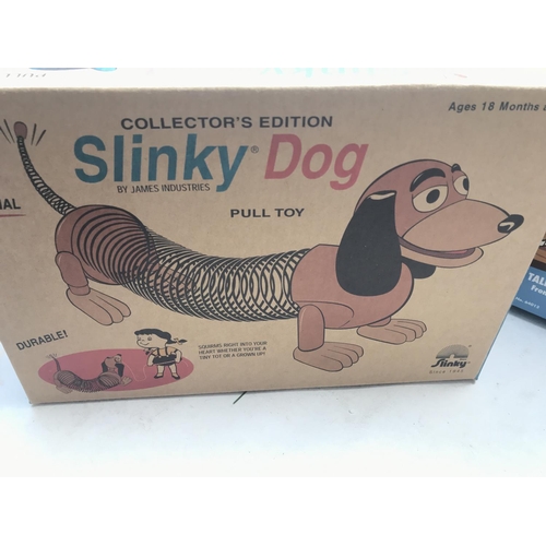 505 - A Collection of Toy Story Figures including a Loose and Boxed Woody and a Slinky Dog.