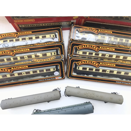 61 - A box containing a collection of Hornby and Mainline coaches all boxed. Plus 3 loose.