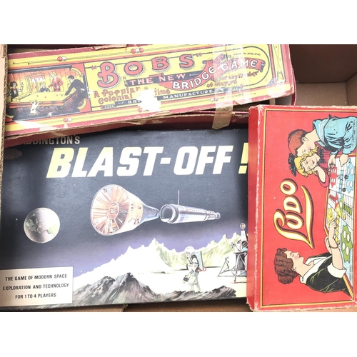 92 - A box containing a collection of Vintage games.