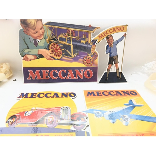 95 - A German Tin Plate clock and 4 Meccano display stands.