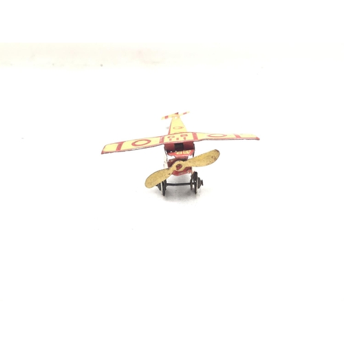 98 - A German Tin Penny toys aeroplane.