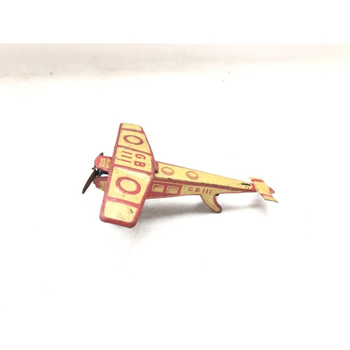 98 - A German Tin Penny toys aeroplane.