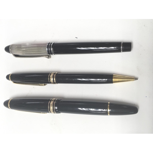 883 - A Mont Blanc fountain pen, a Mont Blanc pencil and an Aurora pen.