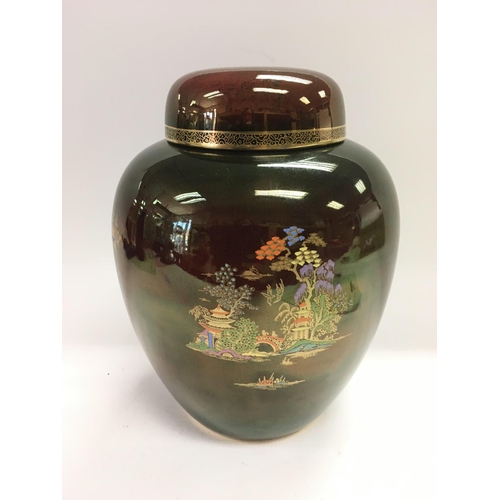 902 - A Crown Devon rouge royal style jar and cover, approx height 23cm.