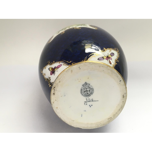 905 - A 1904 Royal Worcester vase in blue with giltwork and handpainted decoration, approx 26cm.