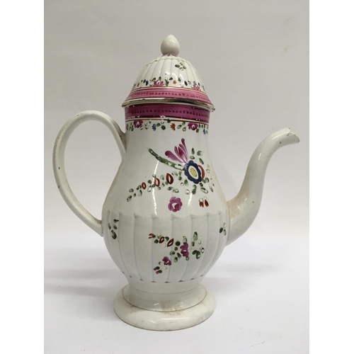 912 - An 18th century English Pearl ware coffee pot decorated with flowers and foliage. 22cm height approx... 