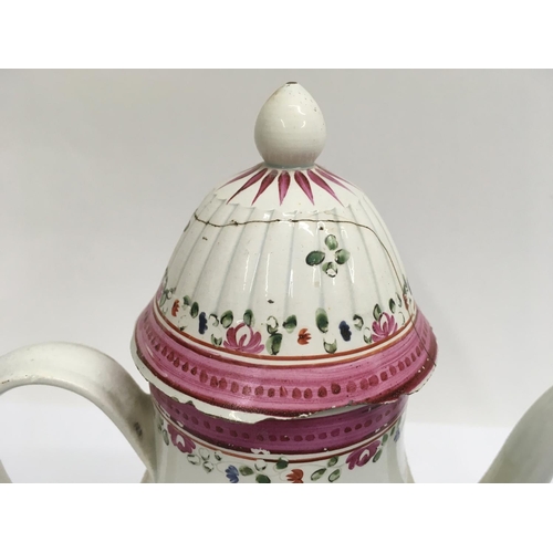 912 - An 18th century English Pearl ware coffee pot decorated with flowers and foliage. 22cm height approx... 