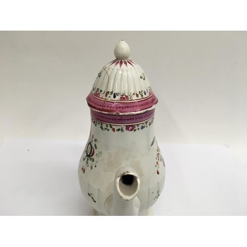 912 - An 18th century English Pearl ware coffee pot decorated with flowers and foliage. 22cm height approx... 