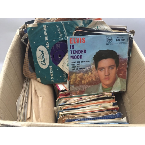 113 - A box containing a collection of EPs, 7inch singles and LPs by various artists including Elvis Presl... 