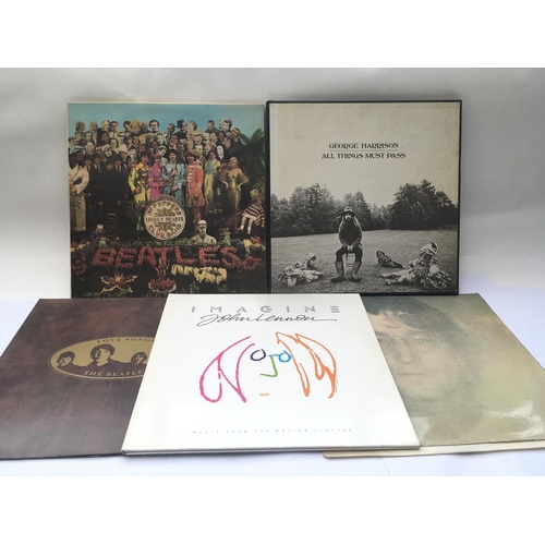 114 - Five Beatles and solo LPs comprising an early UK pressing of 'Sgt Pepper...'  (cut outs missing), 'A... 