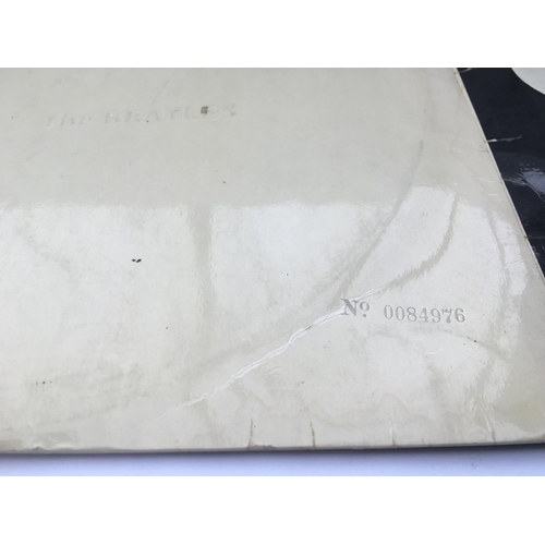 133 - Three early UK pressings of Beatles LPs comprising a numbered 'White Album' no.84976 (no poster or p... 