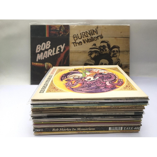 141 - A collection of reggae LPs and 12inch singles by various artists including Bob Marley, Toots & The M... 