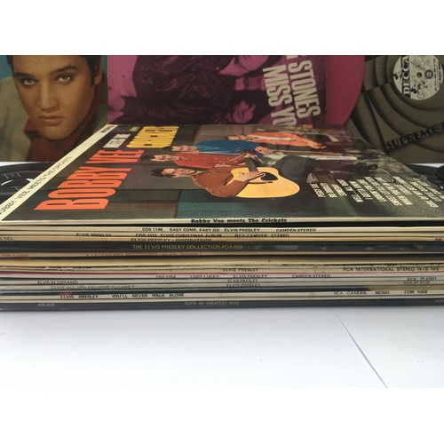 151 - A collection of mainly Elvis Presley LPs and 7inch singles. Includes a pink vinyl Rolling Stones 12i... 