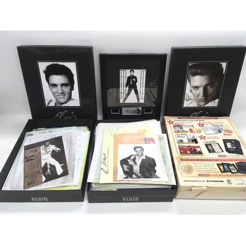 306 - A collection of Elvis Presley memorabilia including DVDs, books, wall plaques etc.