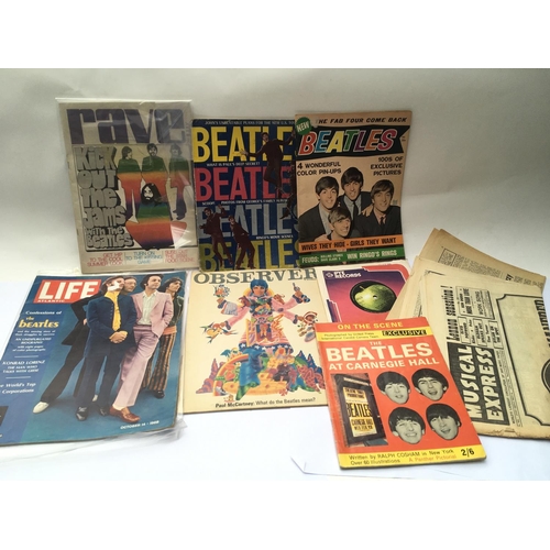 539 - A collection of 1960s Beatles album adverts, a Get Back book, Mary Hopkin single plus various other ... 