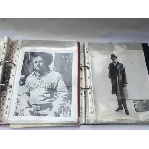 551 - Two binders of old movie publicity prints.