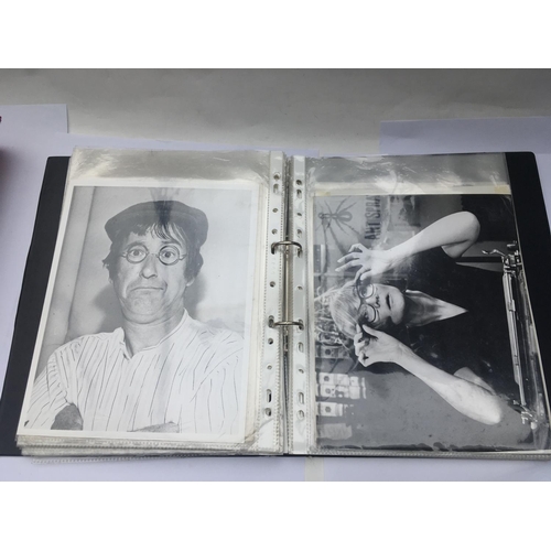 551 - Two binders of old movie publicity prints.