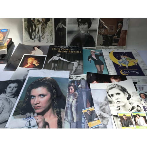 570 - A collection of Carrie Fisher and Star Wars related items including a signed print, various publicit... 