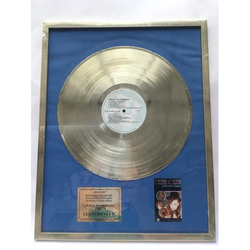 619 - A framed and glazed Culture Club gold disc in recognition of the sale of over 1,000,000 copies of th... 