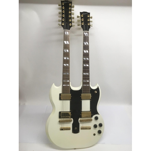 701 - A Gibson double neck 6 and 12 string electric guitar in white with a black scratchplate and gold pla... 