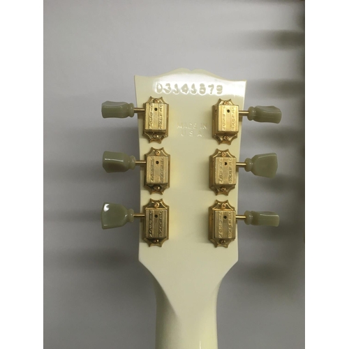 701 - A Gibson double neck 6 and 12 string electric guitar in white with a black scratchplate and gold pla... 