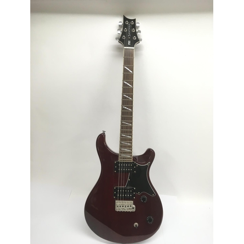 707 - A PRS Santana ES electric guitar in wine red with a black scratchplate. Serial number D04137. Comes ... 