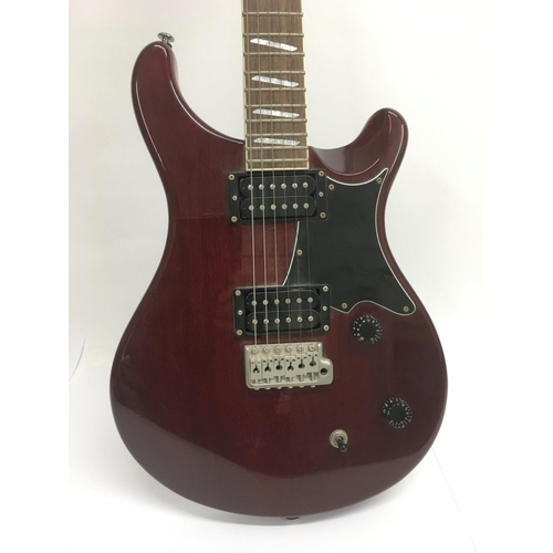 707 - A PRS Santana ES electric guitar in wine red with a black scratchplate. Serial number D04137. Comes ... 