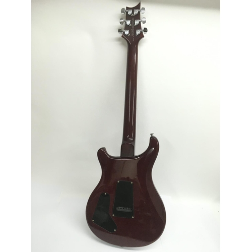 707 - A PRS Santana ES electric guitar in wine red with a black scratchplate. Serial number D04137. Comes ... 