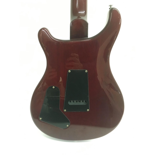 707 - A PRS Santana ES electric guitar in wine red with a black scratchplate. Serial number D04137. Comes ... 