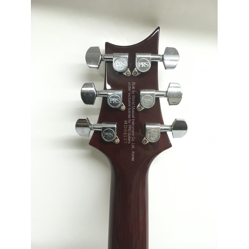 707 - A PRS Santana ES electric guitar in wine red with a black scratchplate. Serial number D04137. Comes ... 