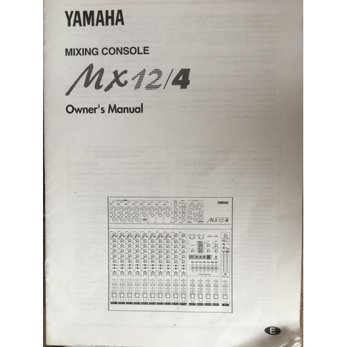 711 - A Yamaha MX12/4 mixing console with instructions.