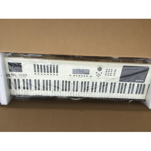 717 - A boxed Oberheim MC3000 midi controller keyboard.