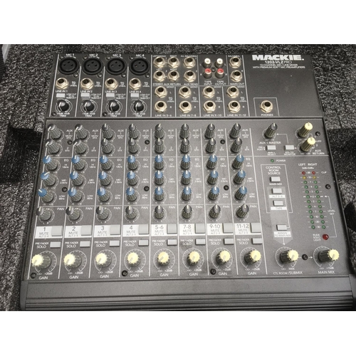 719 - A cased Mackie 1202 VLZ Pro 12 channel mixing console.