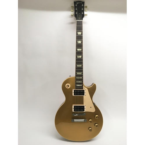 728 - A Gibson Les Paul '1960 Classic' electric guitar, with a gold top finish, serial number 80928. Guita... 