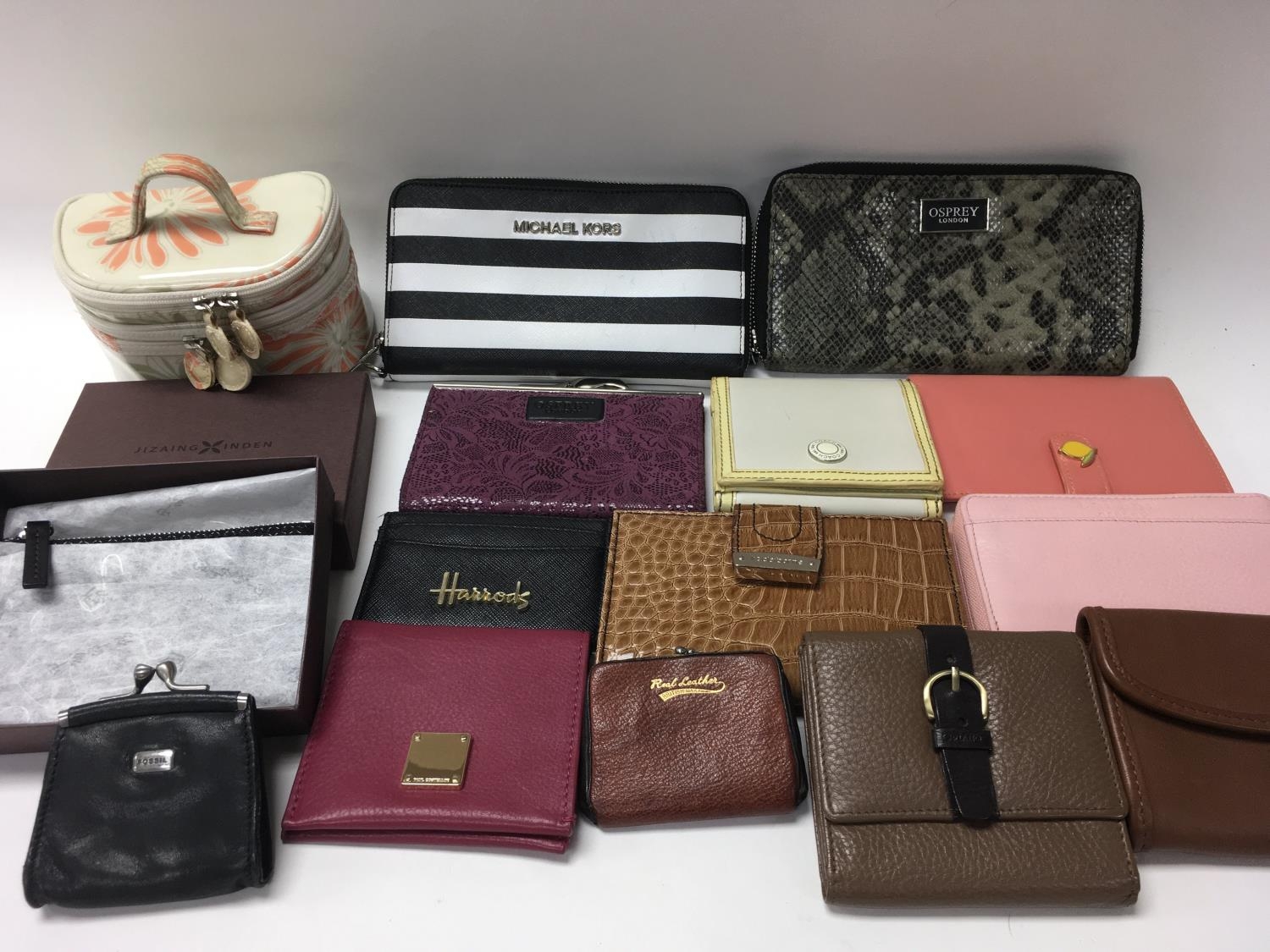 Sixteen designer purses including Osprey Coach Michael Kors etc