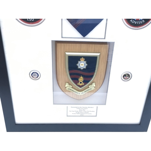 3204 - Framed Police National Search Centre presentation given to Yeoman Warders.
Provided with letter of A... 