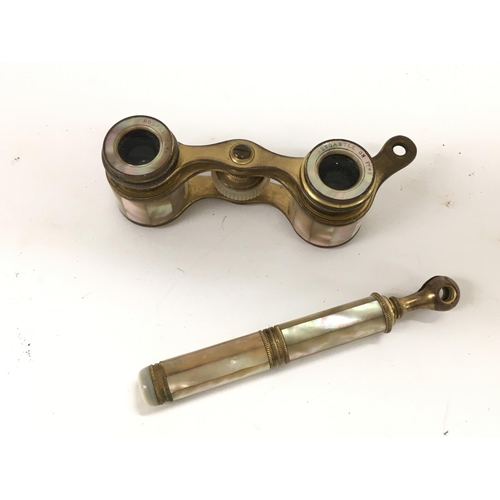 713 - A pair of Edwardian mother of pearl opera glasses.