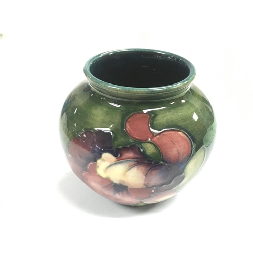 1000 - A small Moorcroft Orchid vase, approx 7cm.