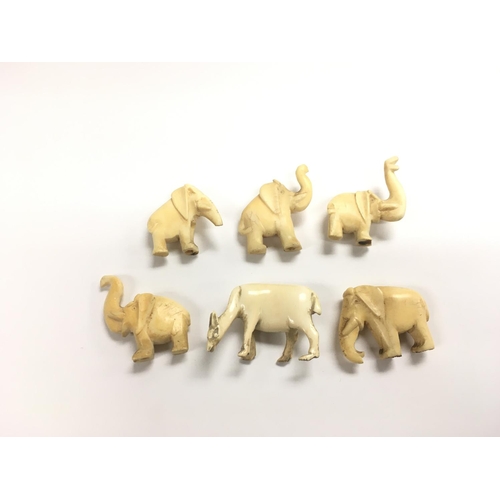 1129 - Five ivory elephants and a deer (6), approx 4cm each in length.