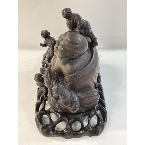 1130 - 1920s Chinese carved Buddha representation, on a stand.