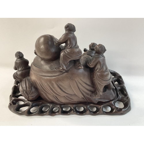 1130 - 1920s Chinese carved Buddha representation, on a stand.