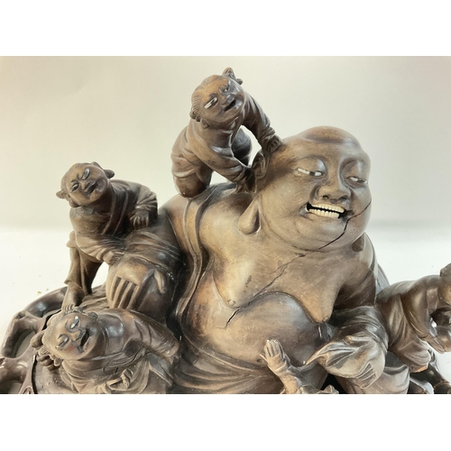 1130 - 1920s Chinese carved Buddha representation, on a stand.