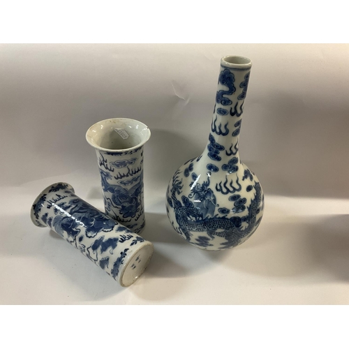 1144 - A Chinese blue and white bottle vase with Dragon and Phoenix design 32cm, together with a pair of fl... 