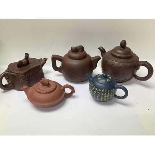 1149 - Five Chinese yixing teapots.
