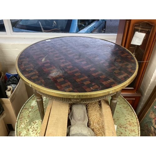1203 - A gilt wooden framed circular table base with a later brass edged top, label to underside of top. 81... 